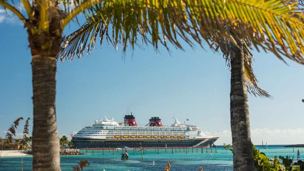 Disney Cruise Ship - Cruise ship docked with blue sky and sea